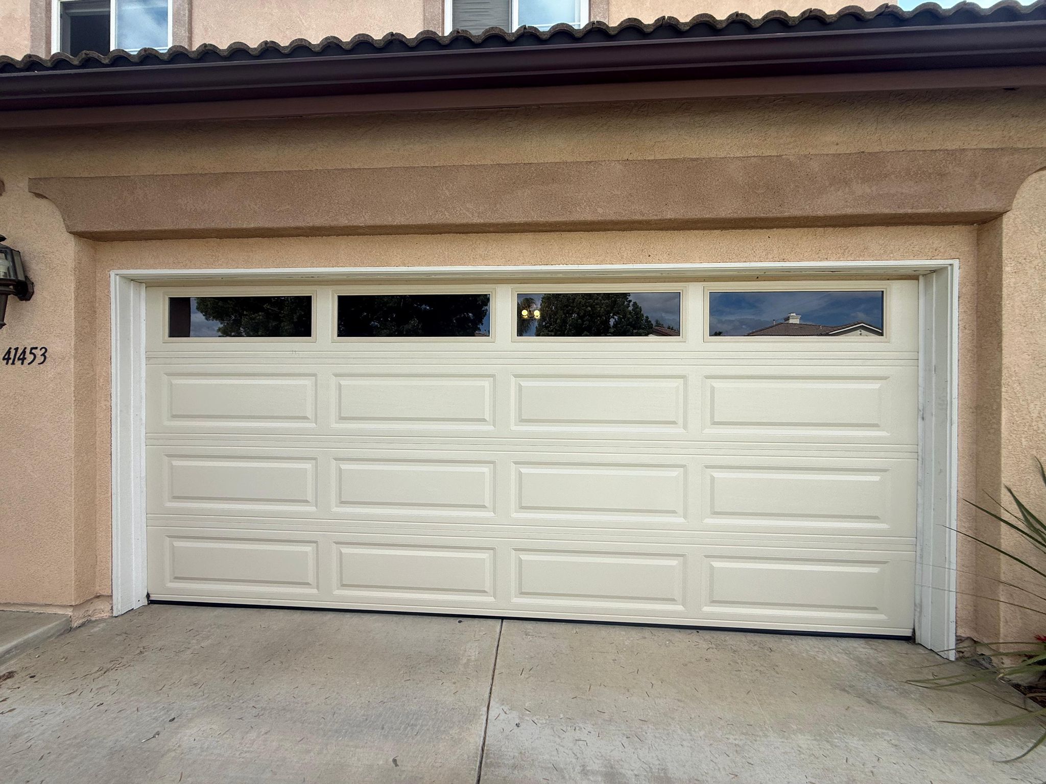 New garage door with windows installed San Diego