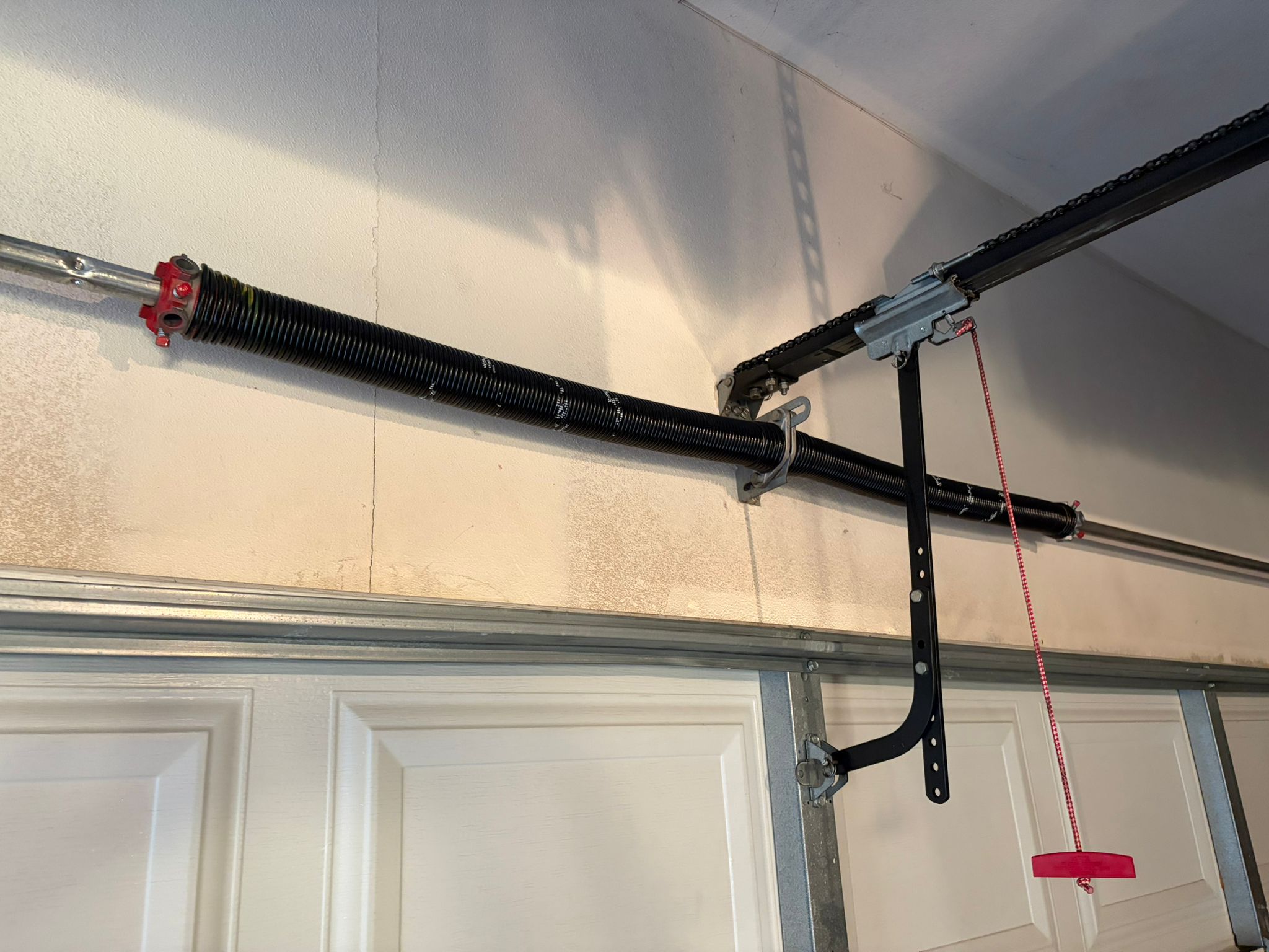 New springs installed on white garage door