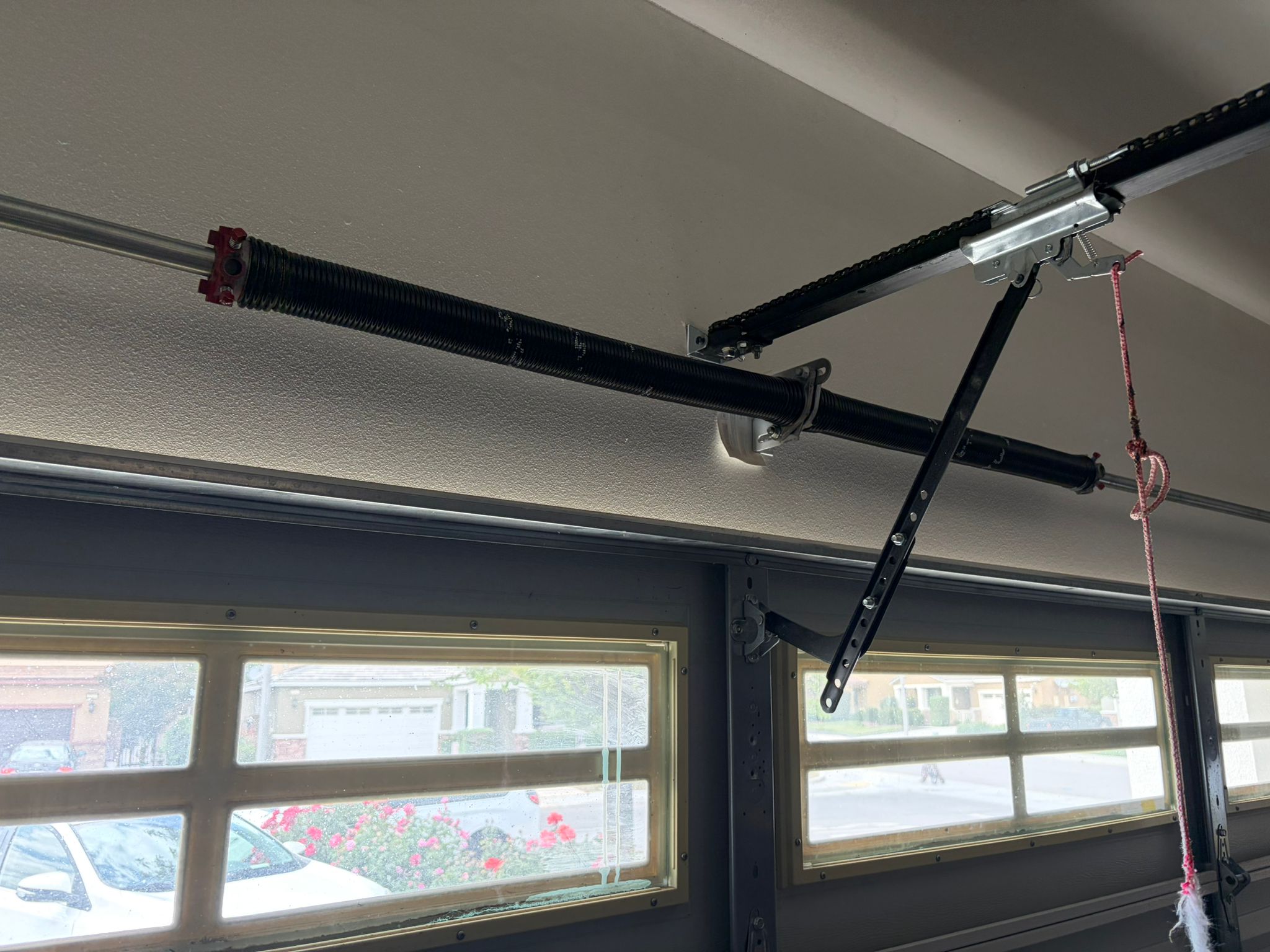 New spring installed on windowed door