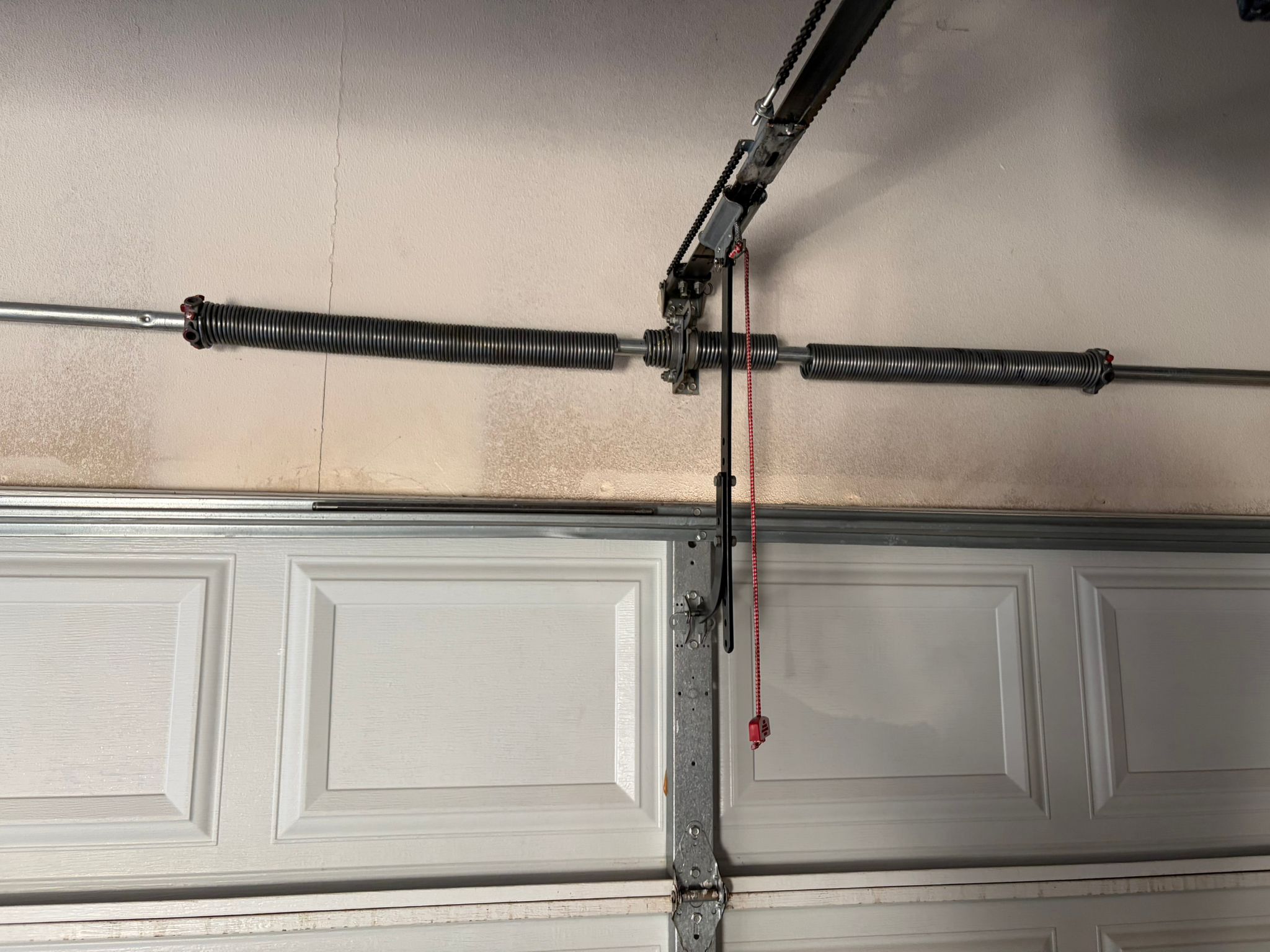 Old garage door springs with red cord