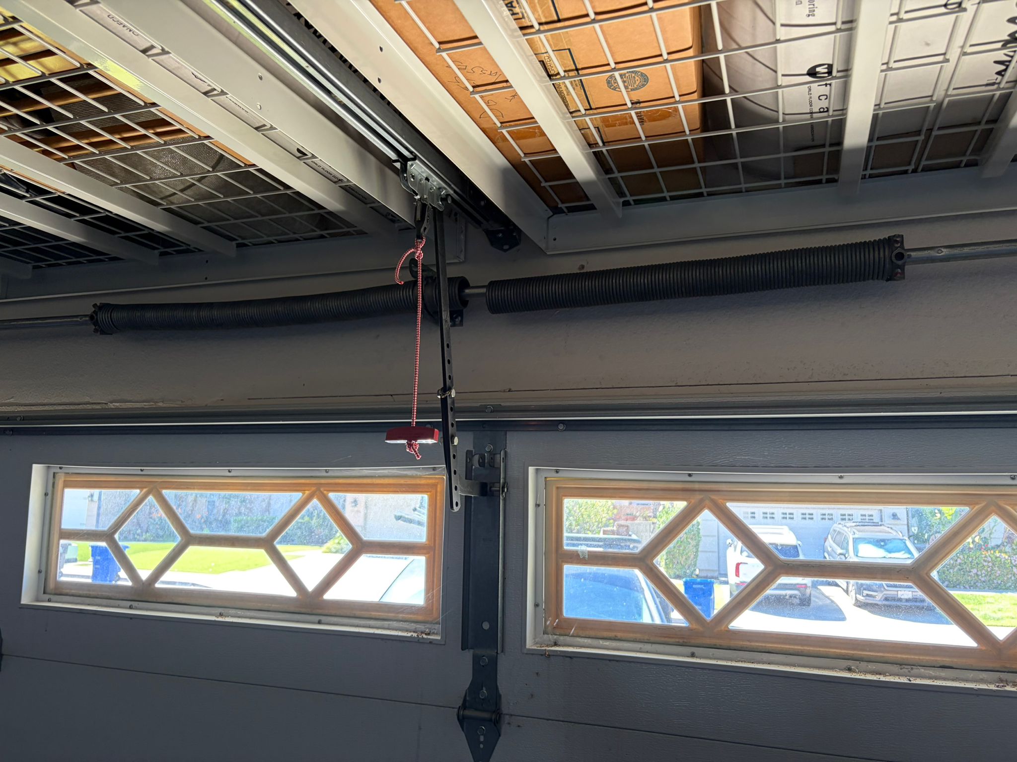 Old spring on diamond window garage door