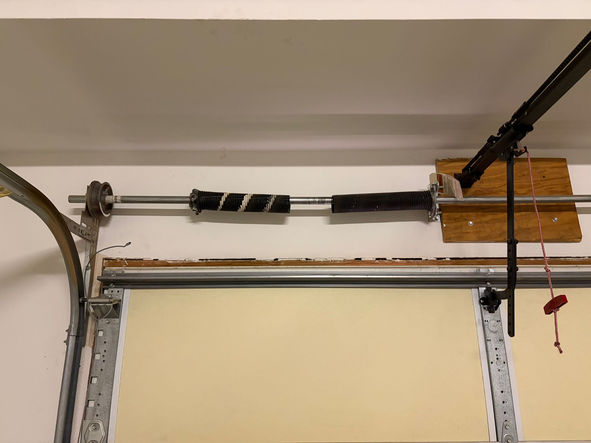 Worn and cracked garage door spring